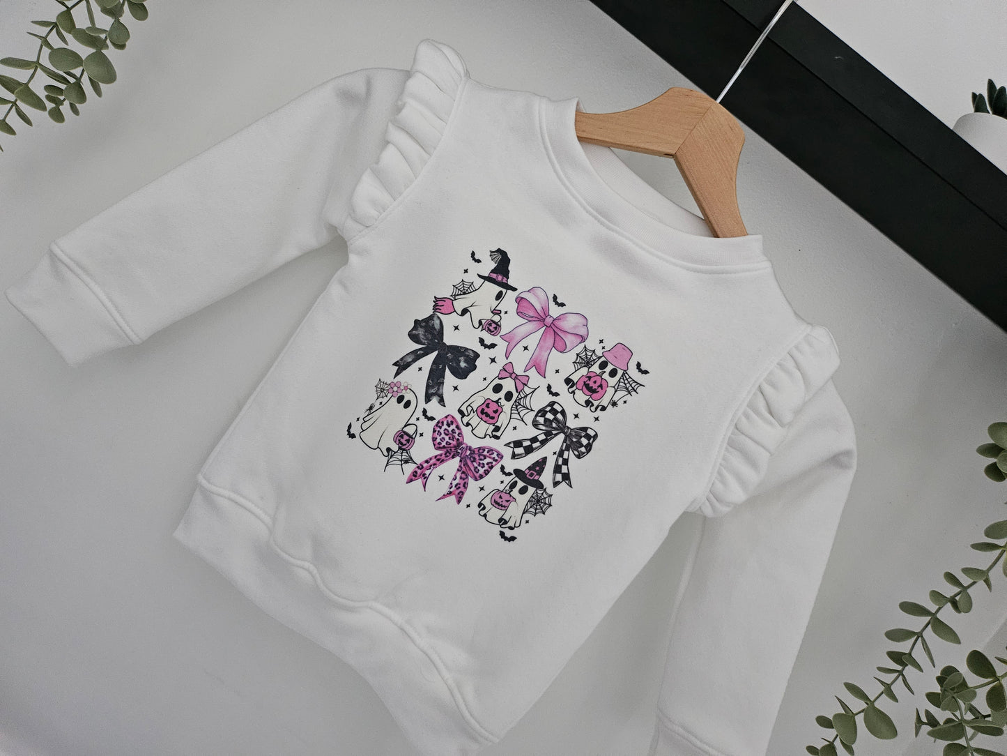 Ghost and bow patter, frilled jumper